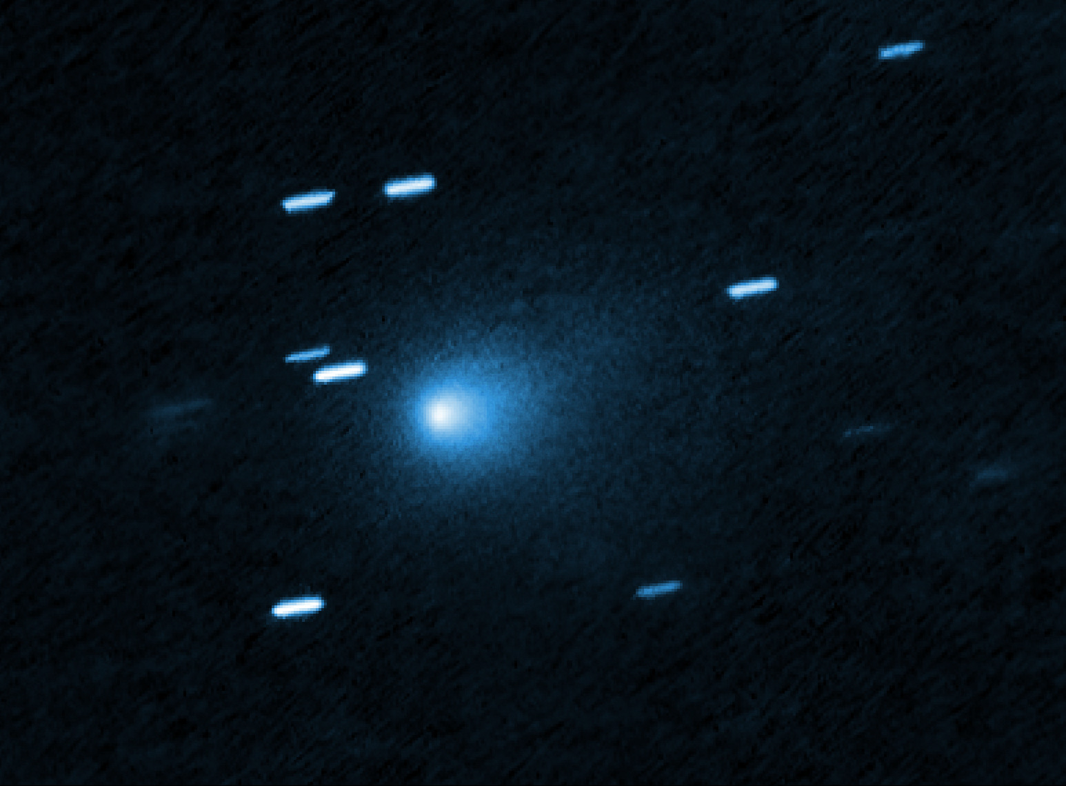 Interstellar comet 3I/ATLAS captured by Hubble Space Telescope showing bright blue coma