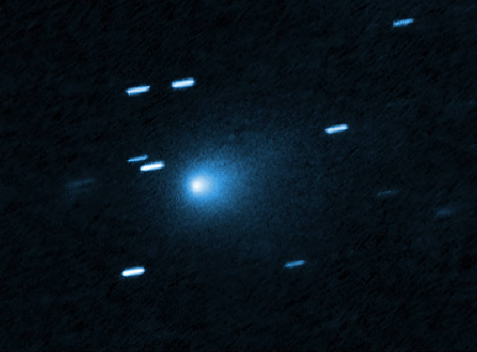 Interstellar comet 3I/ATLAS captured by Hubble Space Telescope showing bright blue coma