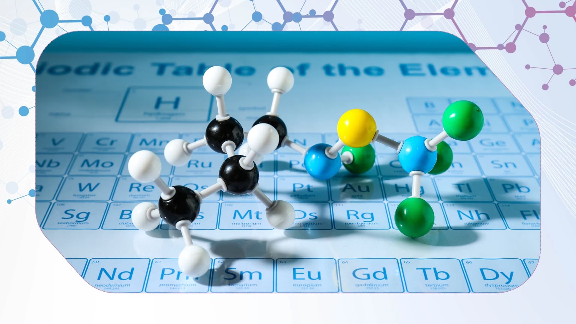 Molecular model placed on a periodic table showcasing chemistry concepts for students