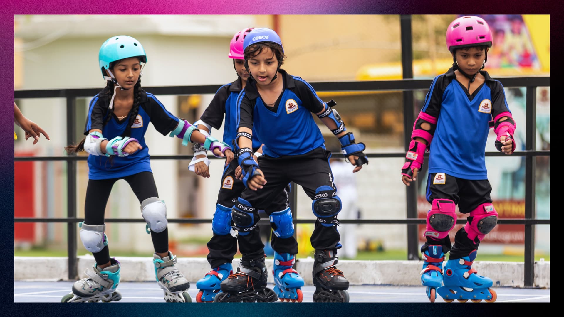 Kids wearing protective gear practising skating on a rink.